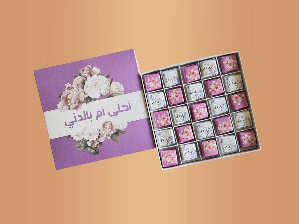 Best mom bundle-Box of chocolates with a floral design on a purple card against a peach background-Lebanon gift delivery