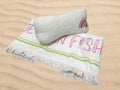 embroidered beach towel and pillow set in white and multicolor