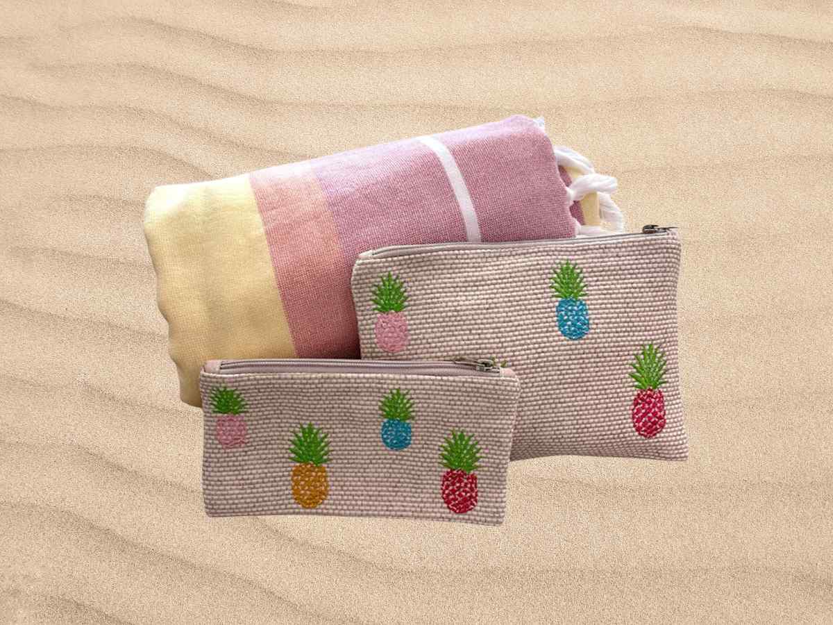 pink beach towel with set of embroidered pineapple pouches