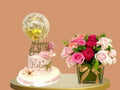 Decorative cake with 'Happy Birthday' and a bouquet of flowers 