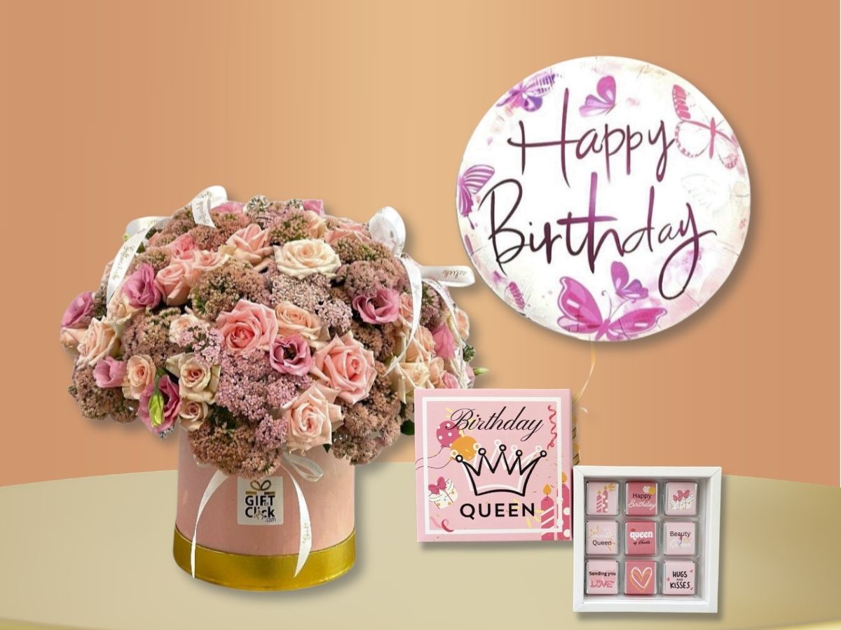 I’ll check the Sweet booms bundle image and write matching alt text.

Sweet Blooms birthday gift bundle with pink and cream roses in a pink hatbox, a butterfly Happy Birthday balloon, and one box of chocolates.
