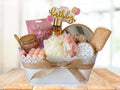 gift hamper with mirror, body mist, hair brush, scalp massager, scrunchie, luffa, bath salts, bath bomb, candle, face mask, face roller lip balm