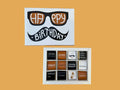 Box of chocolates with a birthday cover featuring sunglasses and a mustache