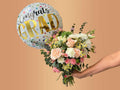 bouquet of flowers with a 'Congrats Grad' balloon 