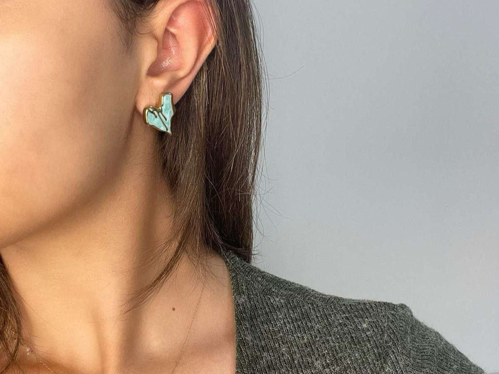 earring with blue melting heart design