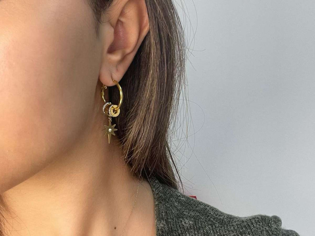  gold hoop earrings with star and triangle charms 