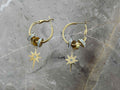 Gold hoop earrings with star-shaped charms 