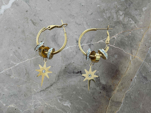 Gold hoop earrings with star-shaped charms 