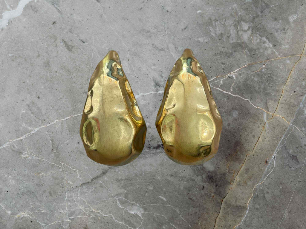 Pair of gold-colored stone-shaped earrings 