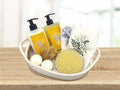 body wash and lotion set, bath bombs, luffa brush and two embroidered towels