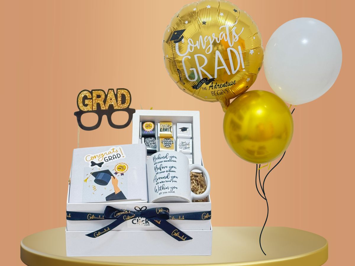 gift for graduation with balloons, chocolate box, mugand topper