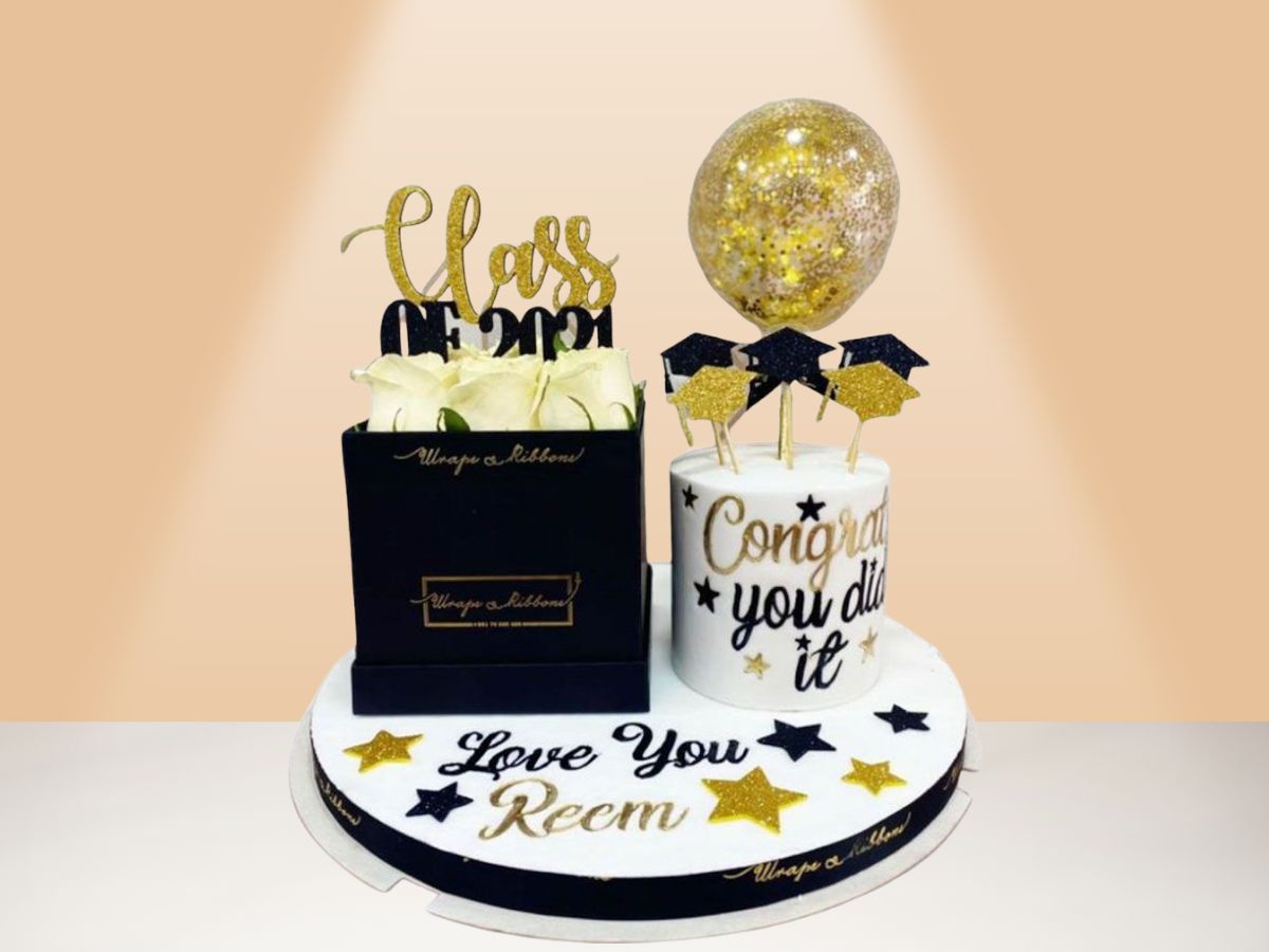 graduation cake with box of roses