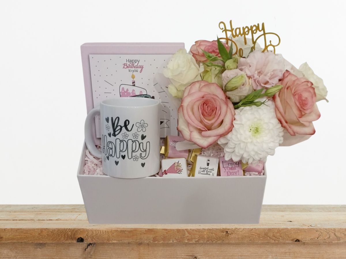 giftbox with fresh flowers, be happy mug and chocolate box