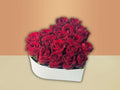 Bouquet of red roses in a heart shaped box
