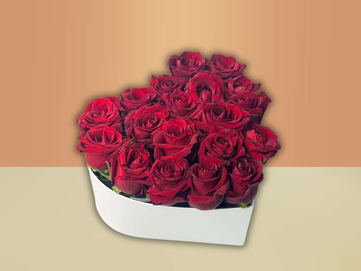 Bouquet of red roses in a heart shaped box