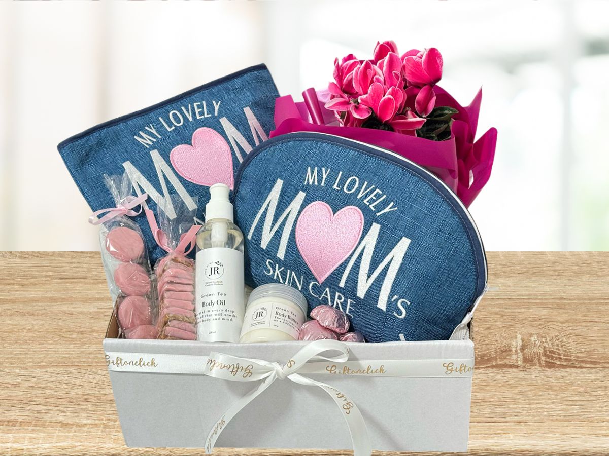 gift for mom with embroidered makeup pouches, body oil, body butter, plant and chocolates