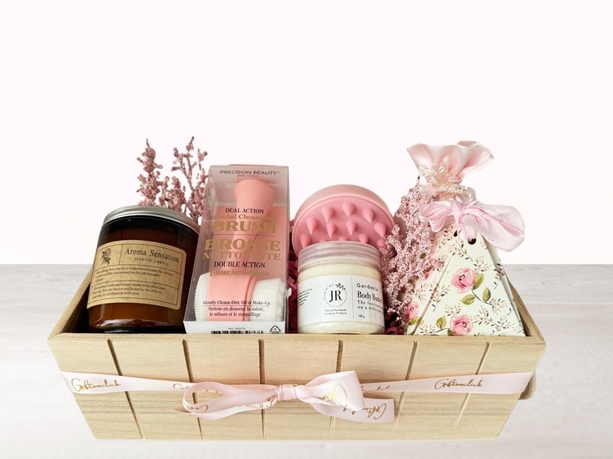 giftbox with candle, face brush, scalp massager, body butter, bath salts and chocolate