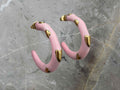 Pink earrings with gold accents
