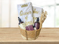 gift basket with queen of the house embroidered towels, hand wash, lotion, soap and essential oil