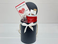 Gift basket with a red card, mug, and chocolates for teachers