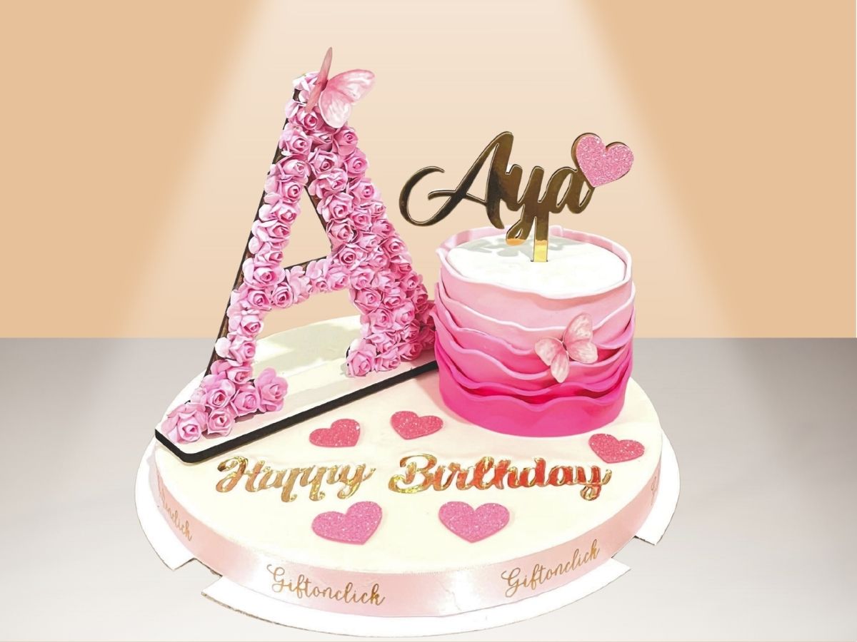 single ruffle cake with flower letter