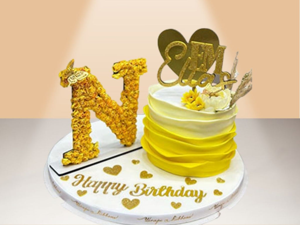 single ruffle cake with flower letter