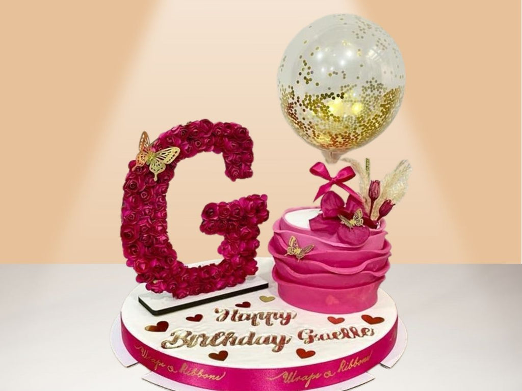 single ruffle cake with flower letter