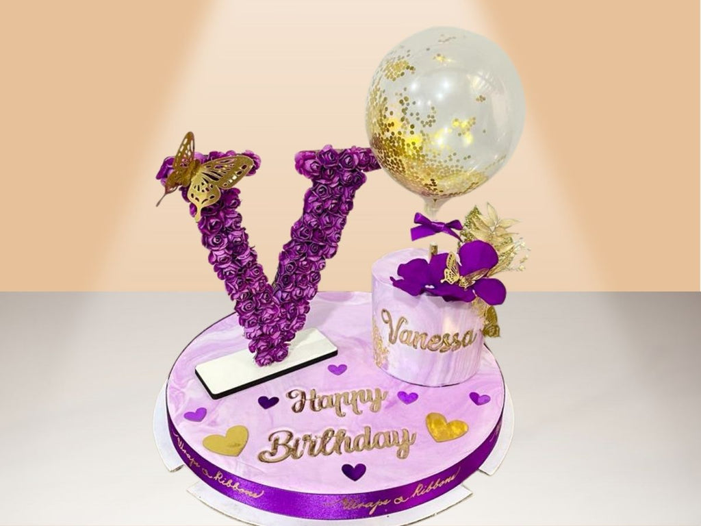 small cake with flower letter