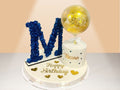 small cake with flower letter