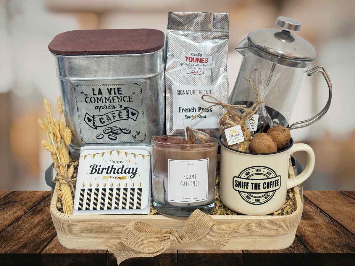 gift tray with french press, coffee blend, coffee canister, chocolate bar, nuts, coffee mug and candle