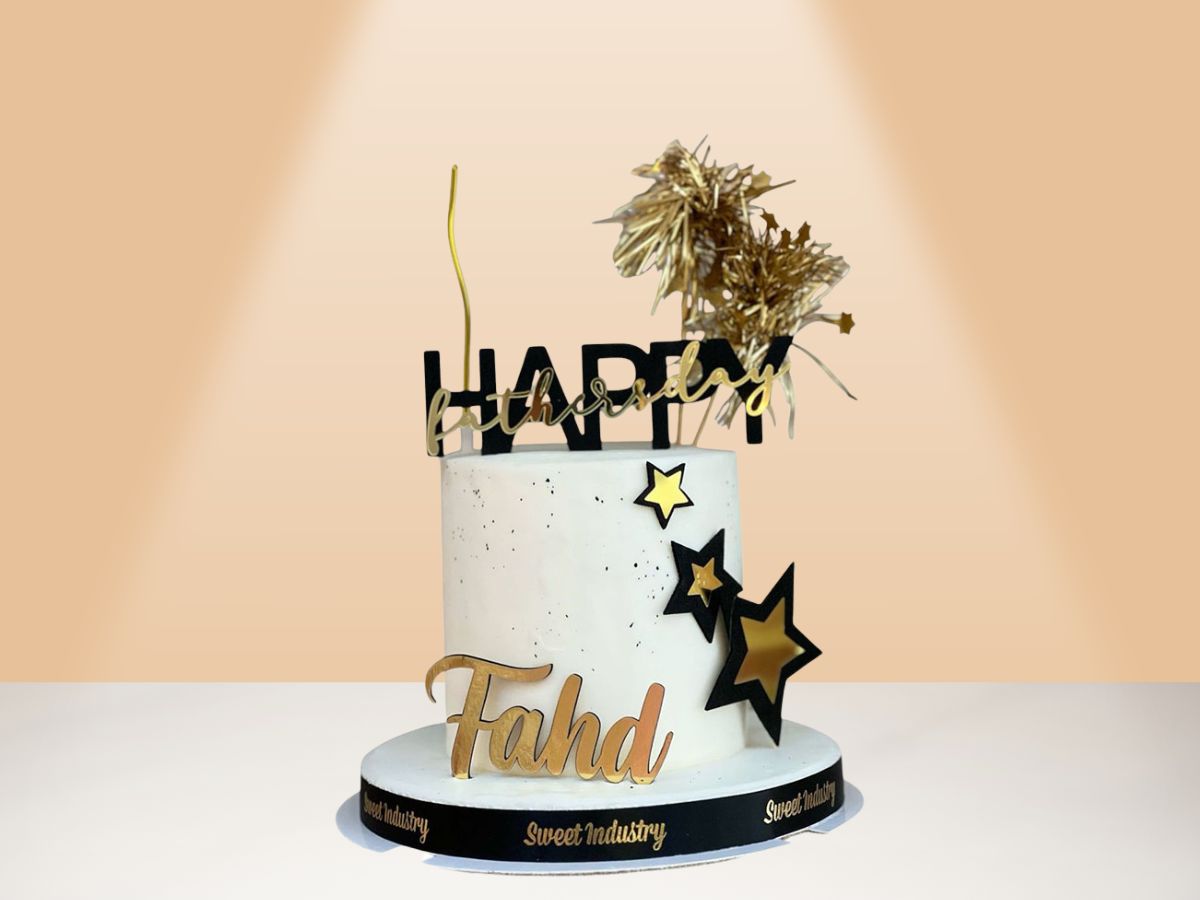birthday cake with gold black and white colors