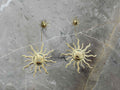 Gold sun-shaped earrings 