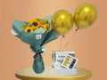 Bouquet of sunflowers, gold balloons, a mug and a chocolate box