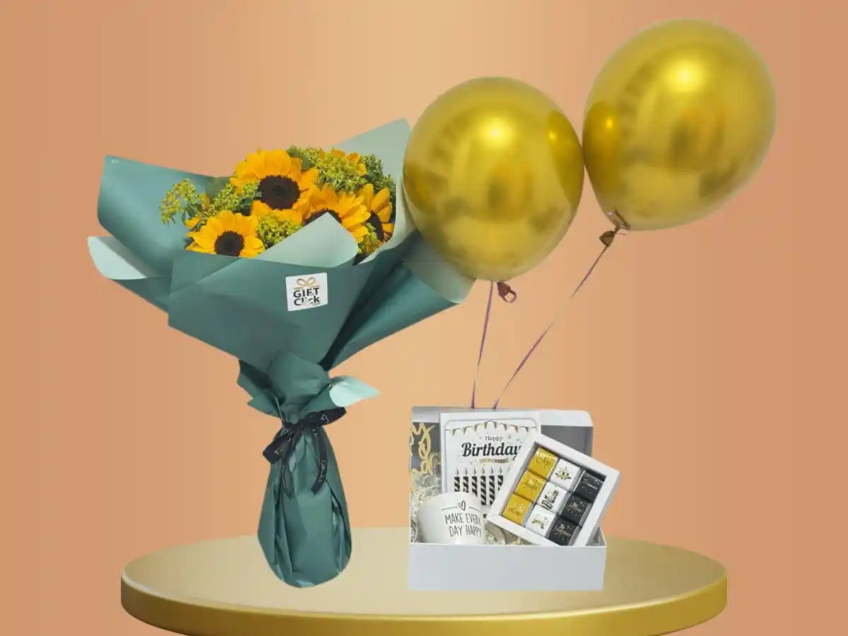 Bouquet of sunflowers, gold balloons, a mug and a chocolate box