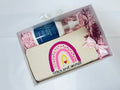 Gift set with pouch, lotion, and flowers in a box 