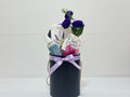 gift box with lavender body spray, lavender towel, fresh flowers, chocolate bar and hair clip
