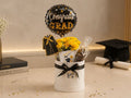 graduation gift with balloon, flowers, chocolate and nuts