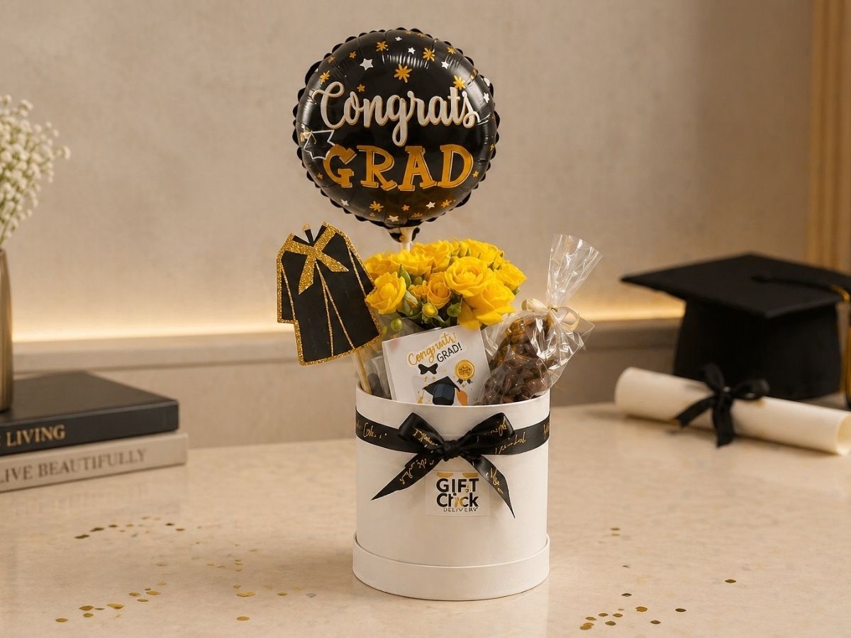 graduation gift with balloon, flowers, chocolate and nuts