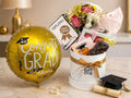 graduation gift with balloon, flowers, chocolates