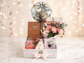 graduation giftbox with notebook, flowers, balloon, chocolates and candle