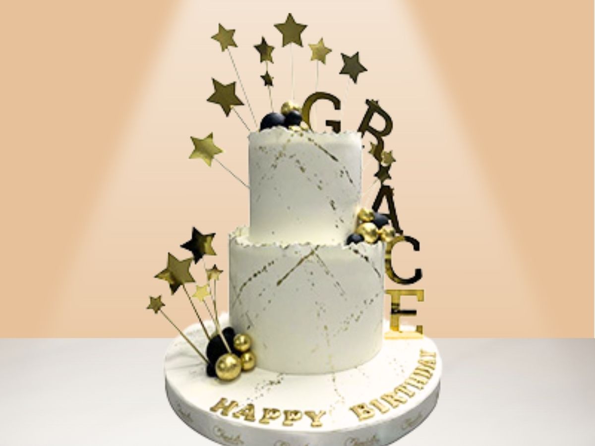 two layer cake with stars and name