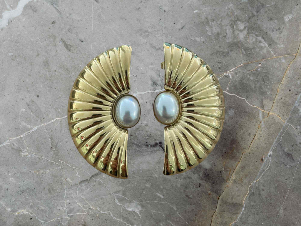 Gold earrings with pearl centers 